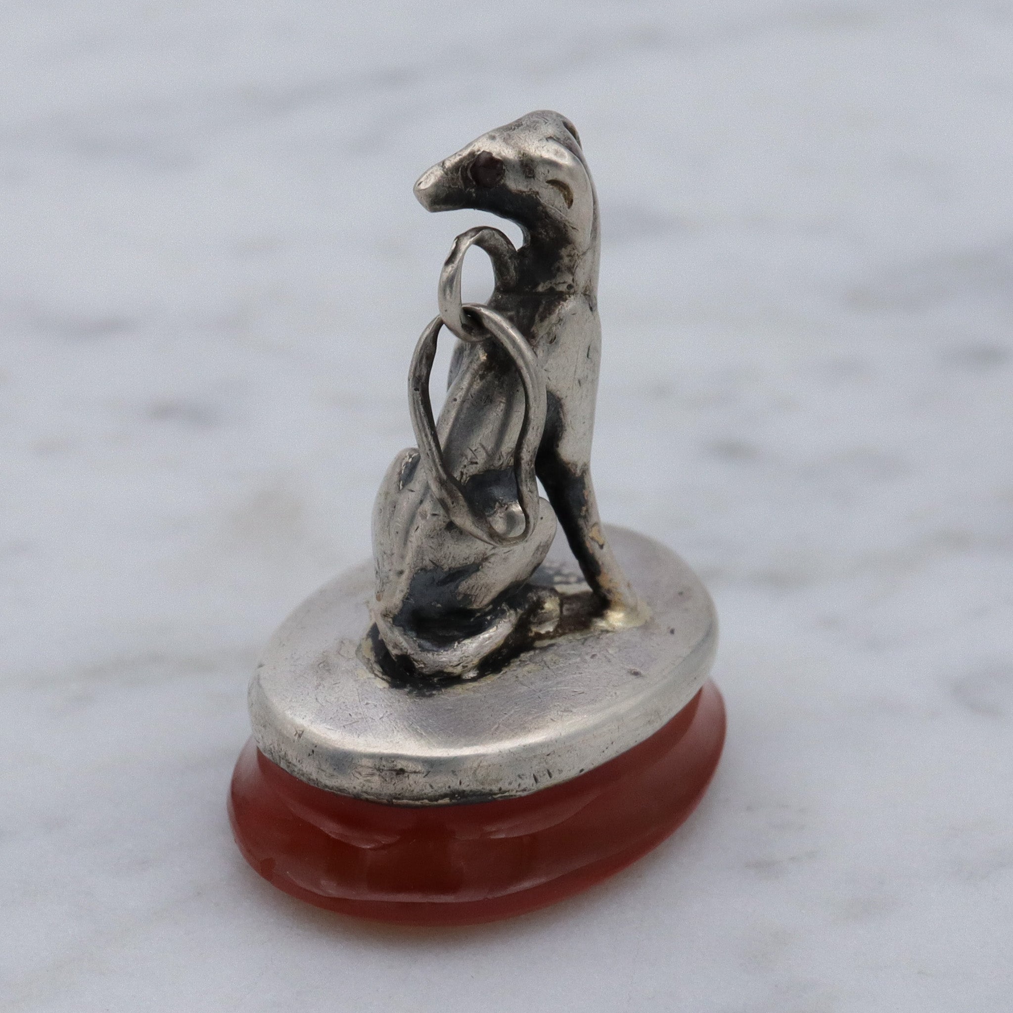 Early Victorian sterling silver greyhound dog on carnelian fob pendant